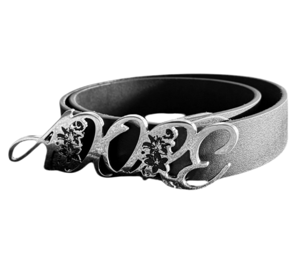 Belt with 'ADORE'  decorative clasp on a white background