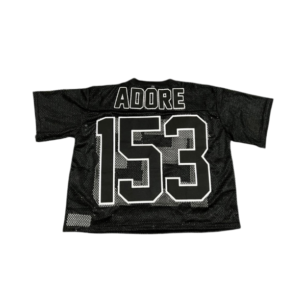 Black sports jersey with 'ADORE' and number '153' on a white background
